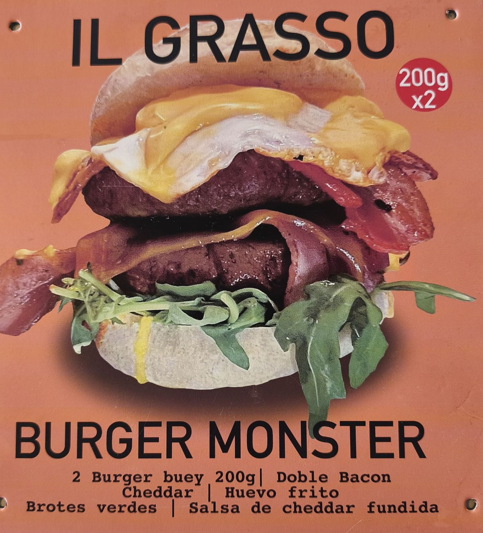 Burger Monster: Hamburguesa doble con tocino, huevo y queso en un pan; el texto incluye ingredientes y peso.