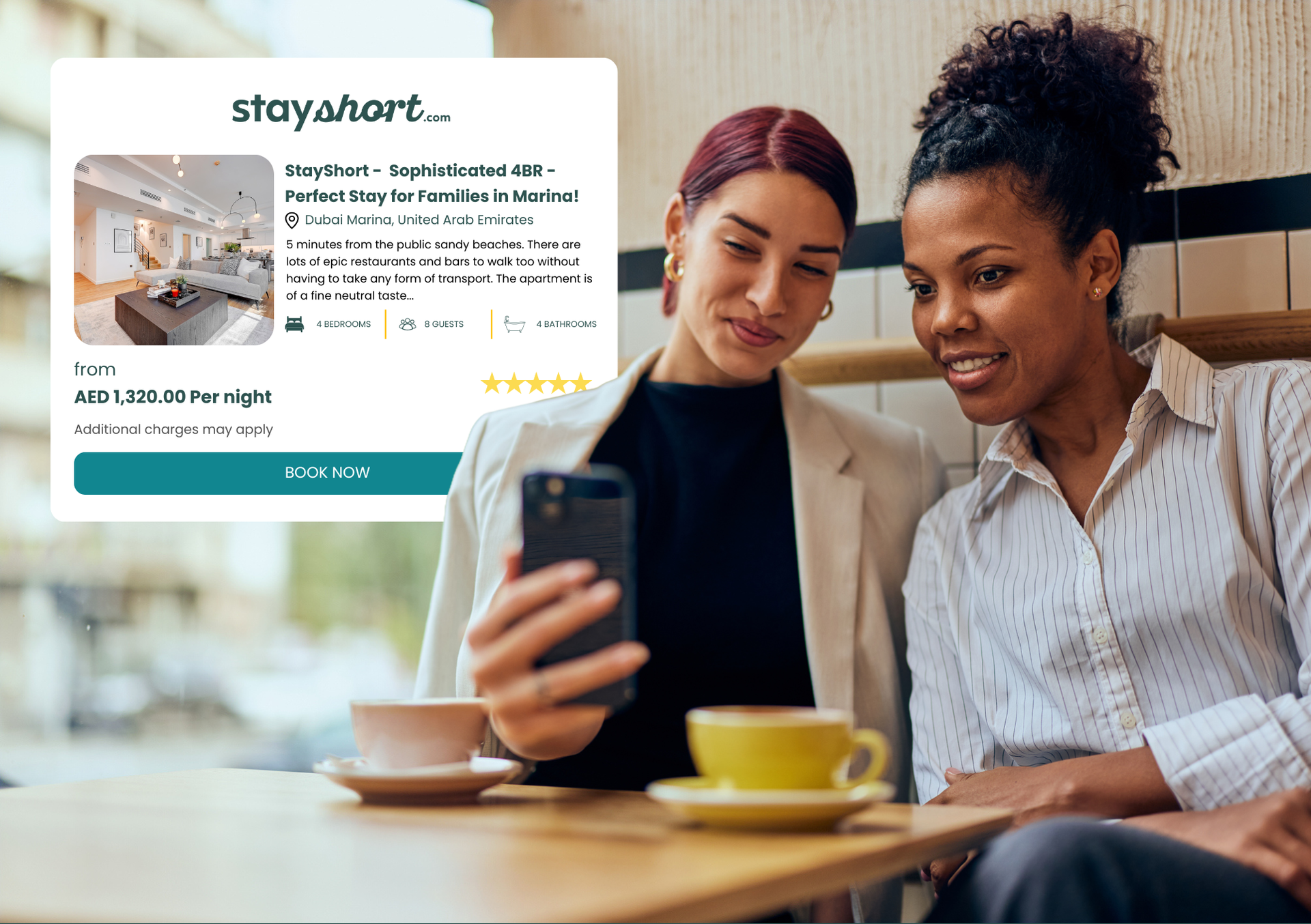 Two women at cafe looking at phone booking a stay on stayshort.com.