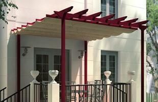 Pérgola roja con toldo retráctil beige en el balcón de un edificio blanco.