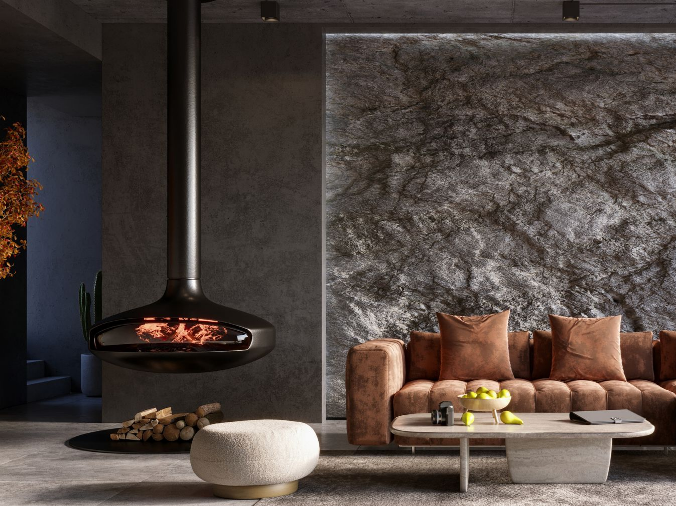 Salon moderne avec cheminée suspendue, mur en pierre et canapé marron.