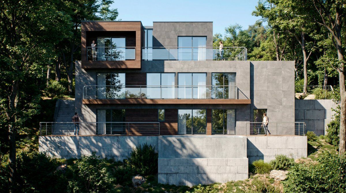 Una casa moderna de varios niveles, con revestimiento de piedra oscura y paneles de madera