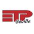 Un logotipo rojo y plateado para etp sevilla sobre un fondo blanco.