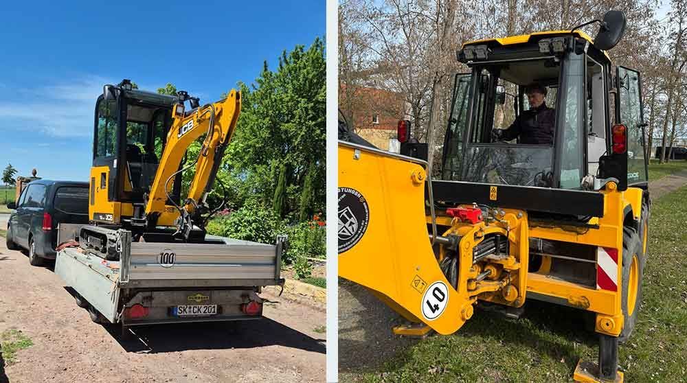 Gelbe Bagger und ein Radlader auf Tiefladern auf einem Baumaschinenhof.