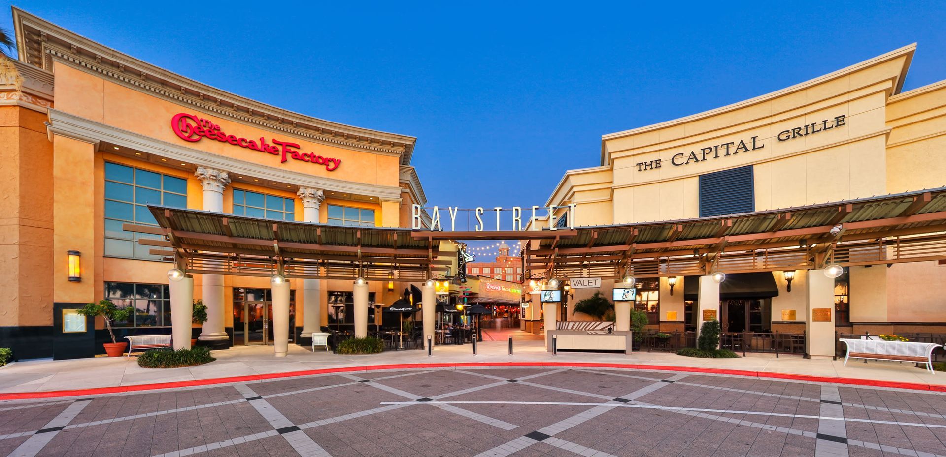 Exterior of a shopping center at dusk with
