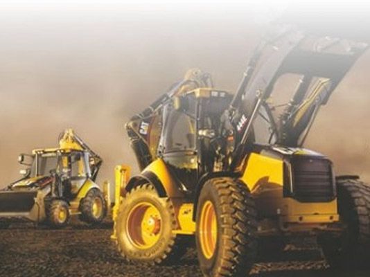 Un tractor amarillo con la palabra gato.