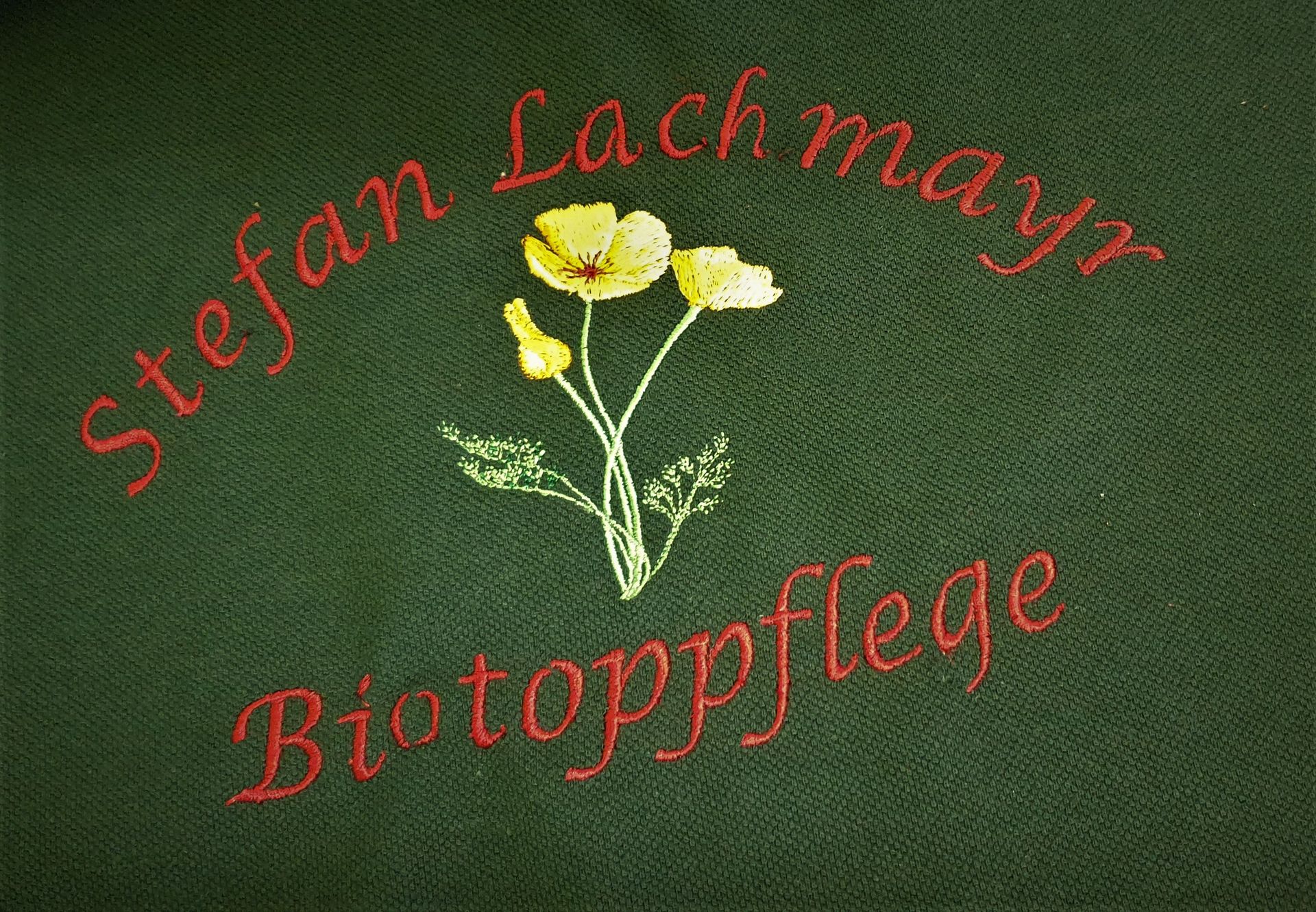 Firmenlogo Bestickung