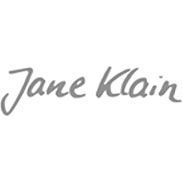 Graues, handgeschriebenes „Jane Klein“-Logo auf weißem Hintergrund