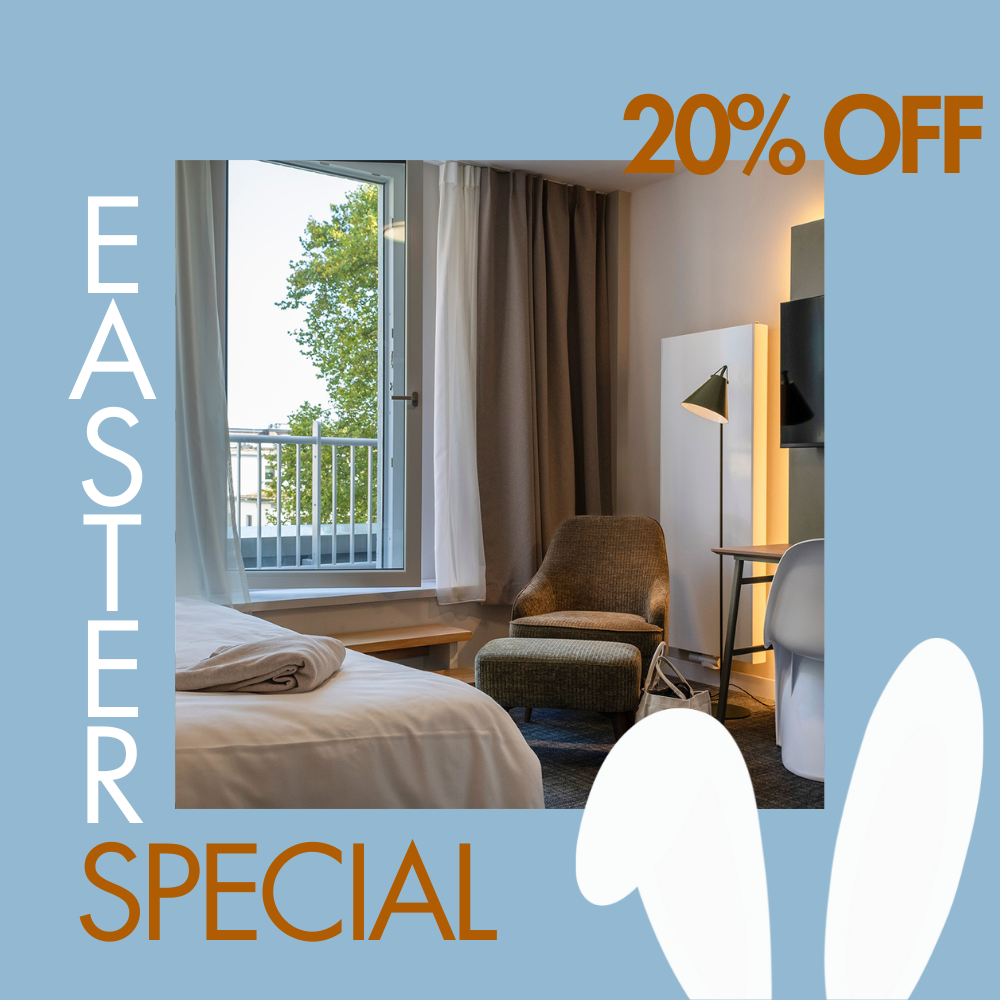 Ein Bett mit einer Decke und Kopfhörern darauf.