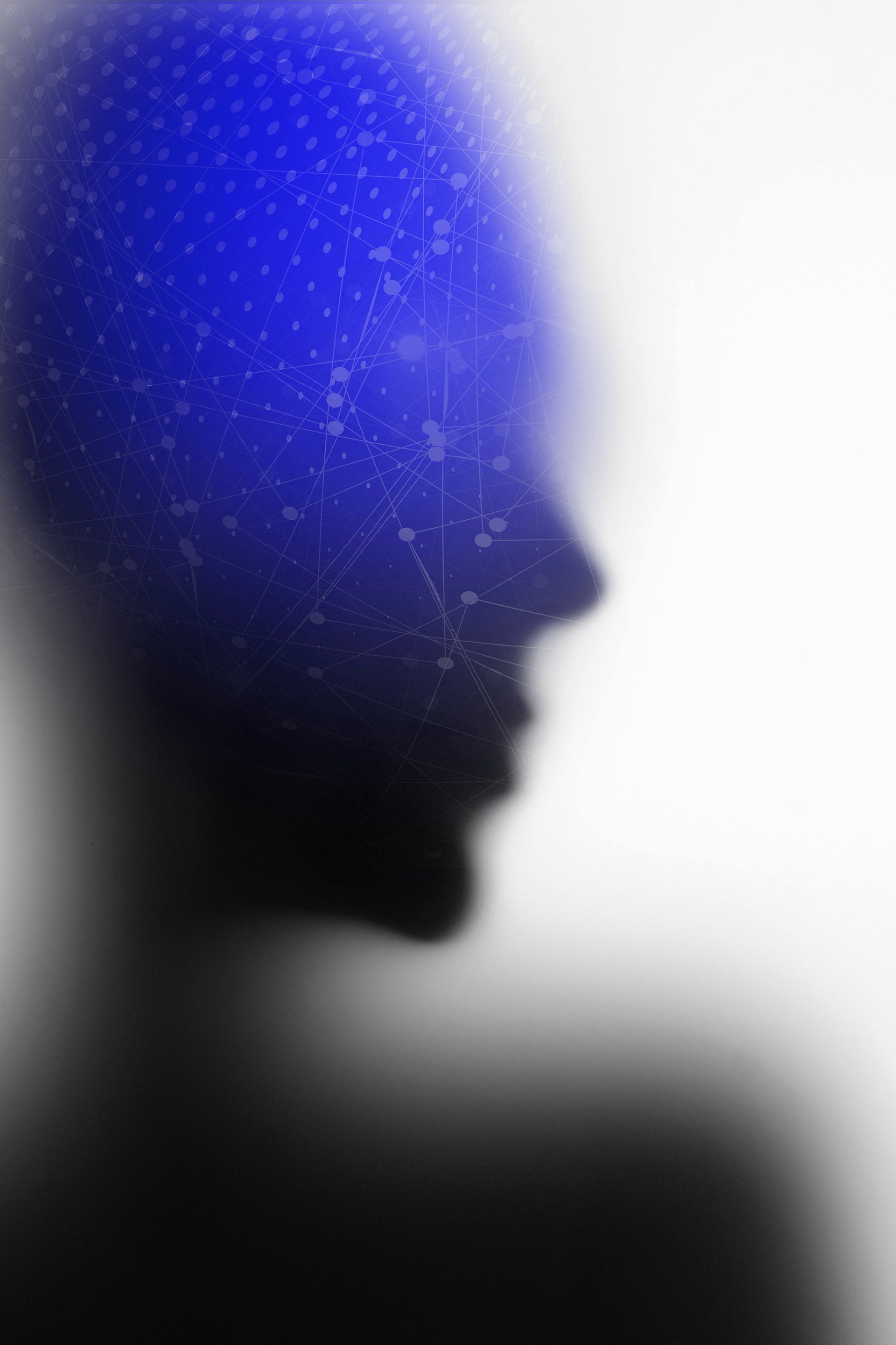 Silueta de perfil de una persona, parcialmente borrosa, con un patrón punteado azul superpuesto en la cabeza, que se desvanece en blanco.