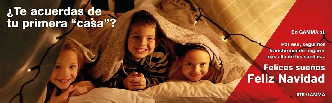 A group of children laying under a blanket with the words 