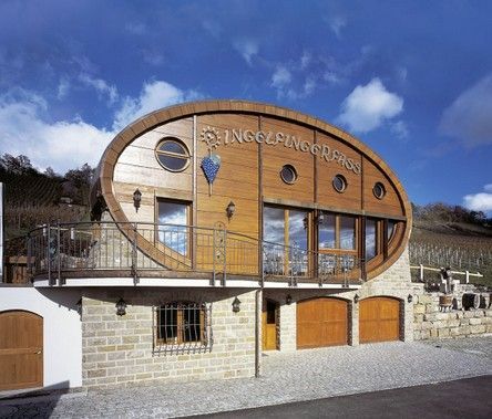 A building with a wooden facade and a balcony has the word prinz on it