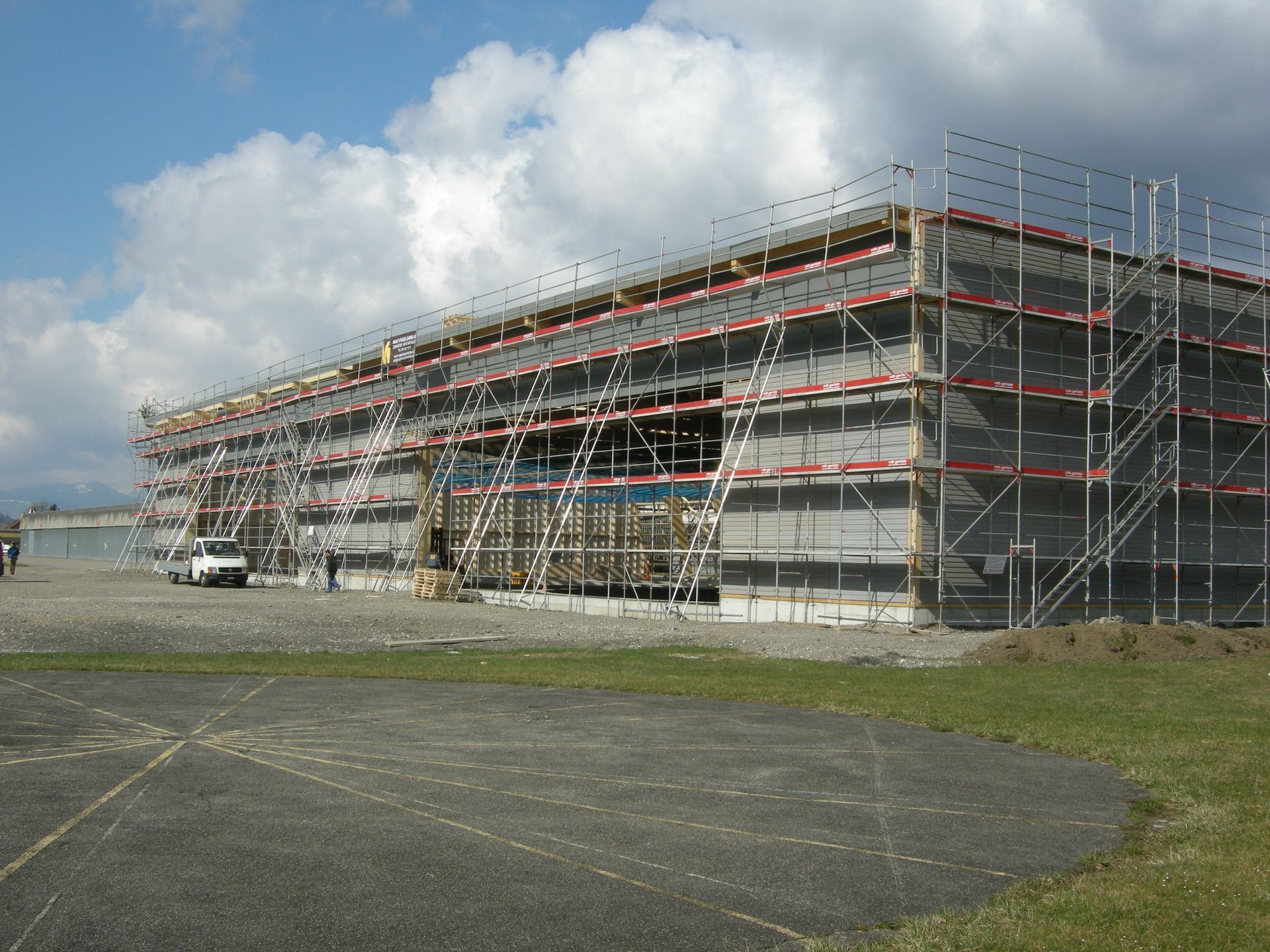 A large building under construction with scaffolding around it