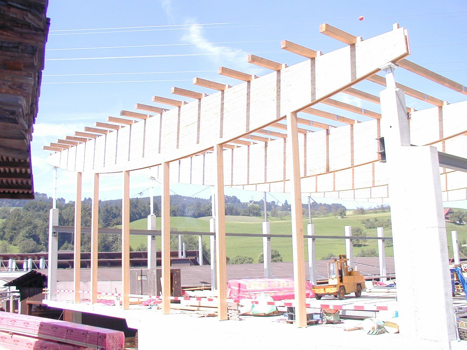 A building under construction with a lot of wooden beams