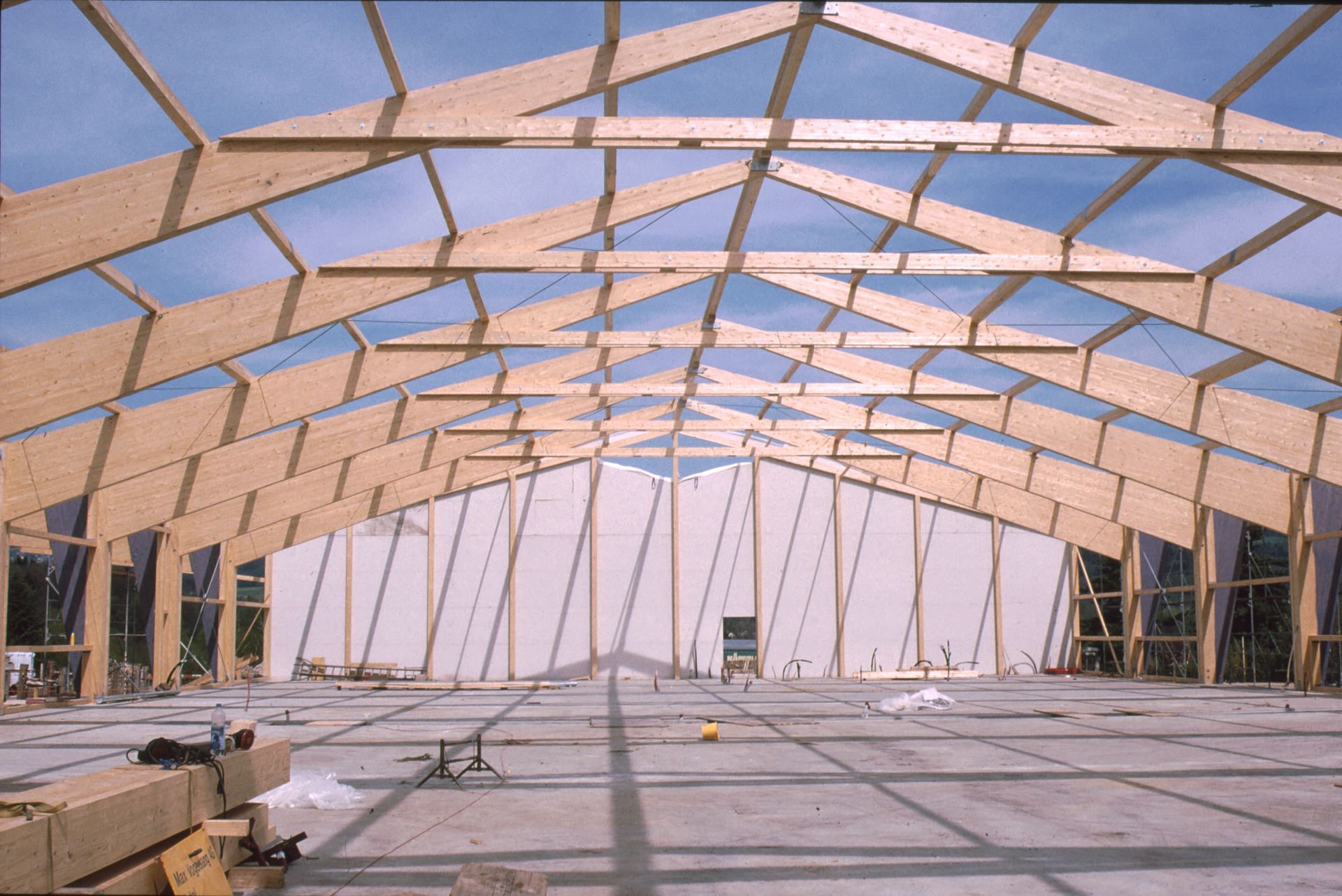A large wooden structure with a blue sky in the background