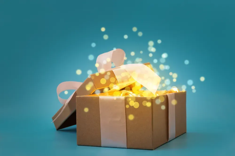 A gift box with a surprise inside of it on a blue background.