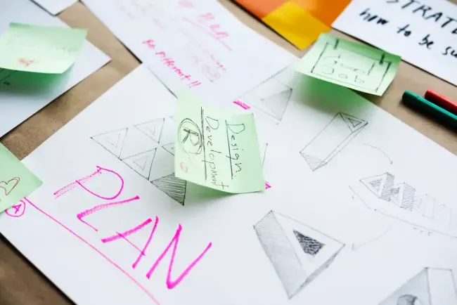 A piece of paper with the word plan written on it
