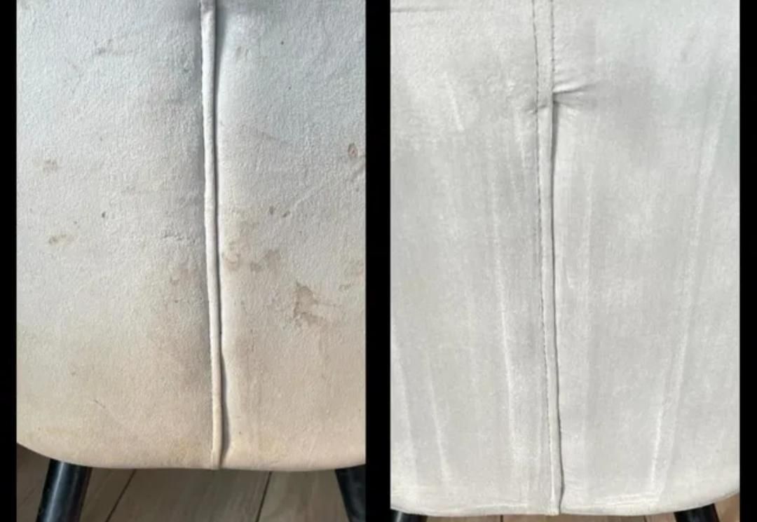 Nahaufnahme einer weißen, gepolsterten Stuhllehne mit senkrechten Nähten und sichtbaren Gebrauchsspuren.