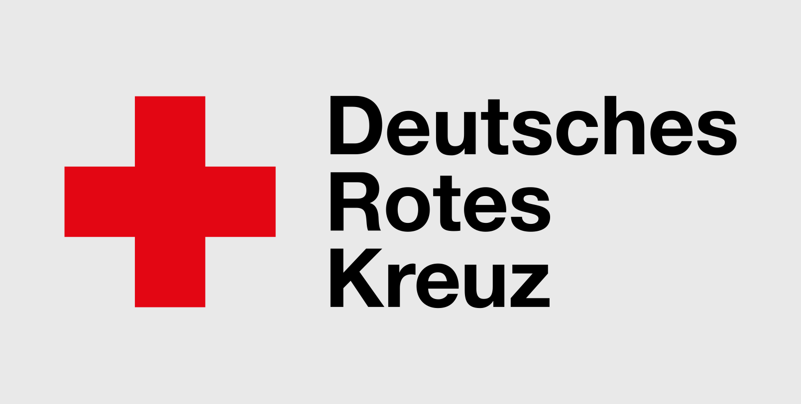 Logo des Deutschen Roten Kreuzes mit einem roten Kreuz und schwarzem Text auf hellem Hintergrund