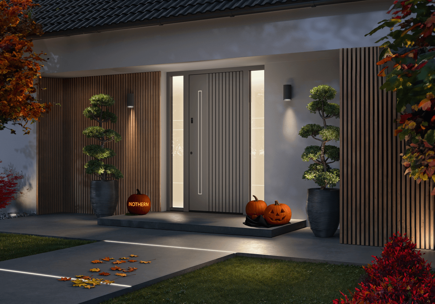 Ein moderner Hauseingang, nachts beleuchtet, zu Halloween mit Kürbissen und beleuchteten Bäumen geschmückt.