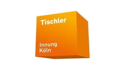An orange cube with the words tischler innung koln written on it.
