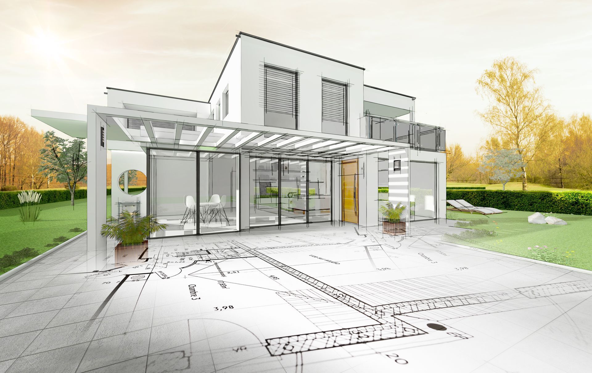 Maison moderne blanche de deux étages avec patio vitré, entourée de verdure et d'arbres aux couleurs d'automne.