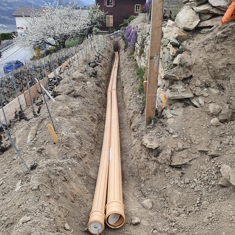 MC Construction Sàrl - Aménagement extérieur - terrassement - goudronnage - dallage - paysagisme