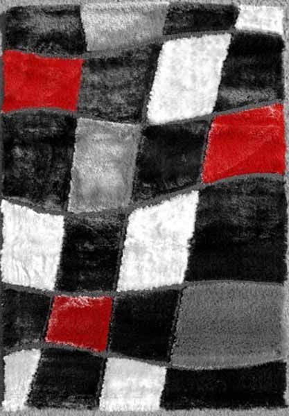 Una alfombra a cuadros negros, blancos y rojos con un cuadrado rojo en el medio.