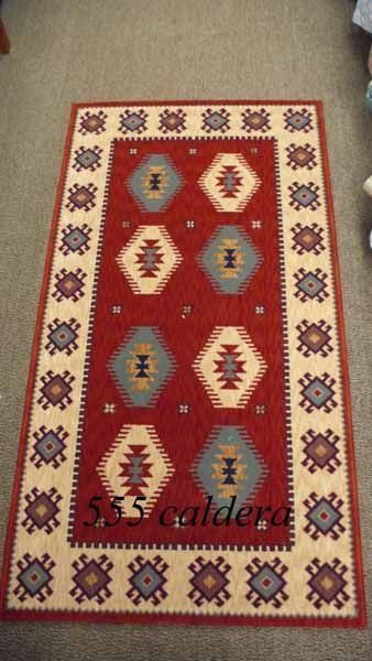 Una alfombra con el nombre caldera.