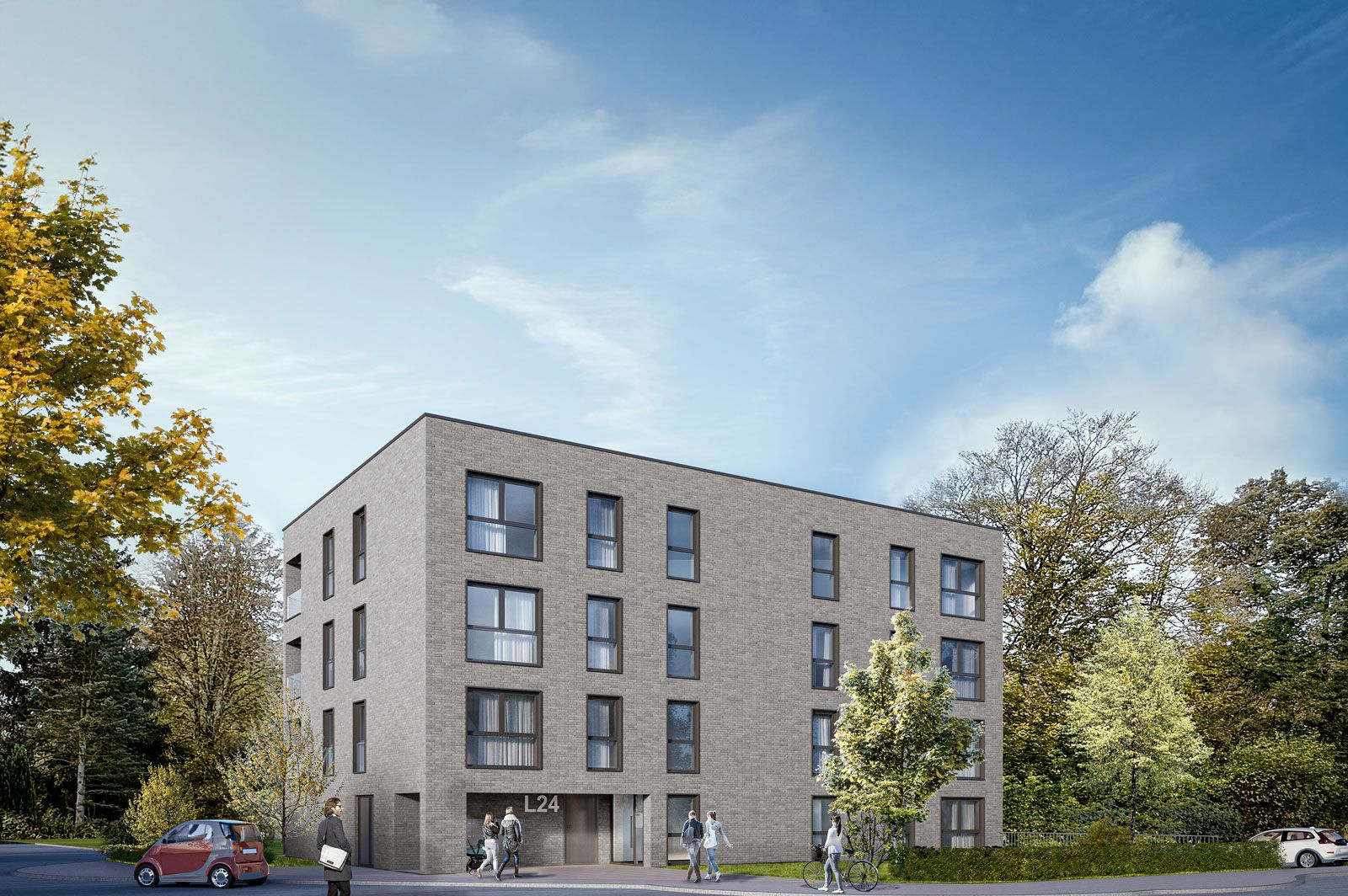 Dreistöckiges Backsteingebäude mit mehreren Fenstern; Menschen gehen draußen entlang; Autos fahren auf der Straße; Bäume umgeben das Gebäude.