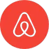 Airbnb-Logo: weißes, geschlungenes Herz auf rotem Kreis