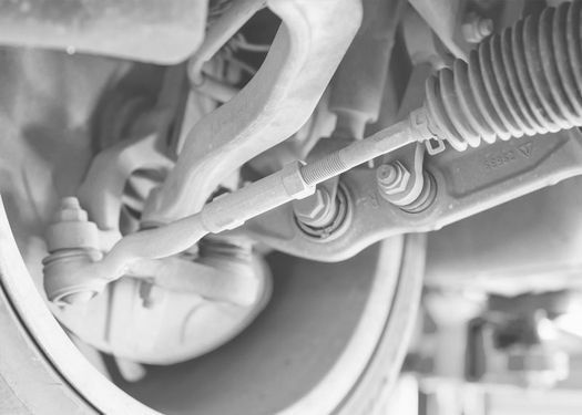Una fotografía en blanco y negro del sistema de suspensión de un automóvil.