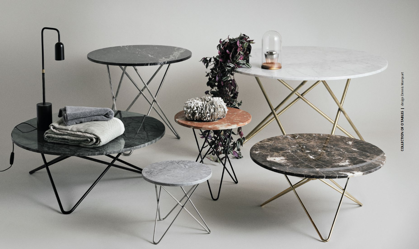 Sammlung von Designer-Couchtischen mit Marmoroptik in unterschiedlichen Farben und Höhen