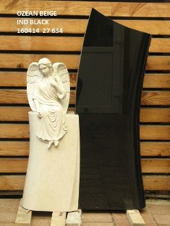 Grabstein in Ozean Beige mit Engel und schwarzem Ind Black Hintergrund.