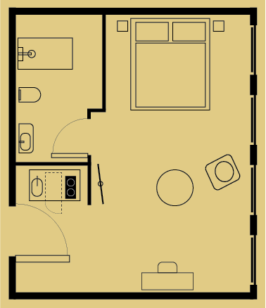 Floor plan of a rectangular room with a bedroom area, small bathroom, and entry closet. Furniture includes a bed, chair, desk, and round table.