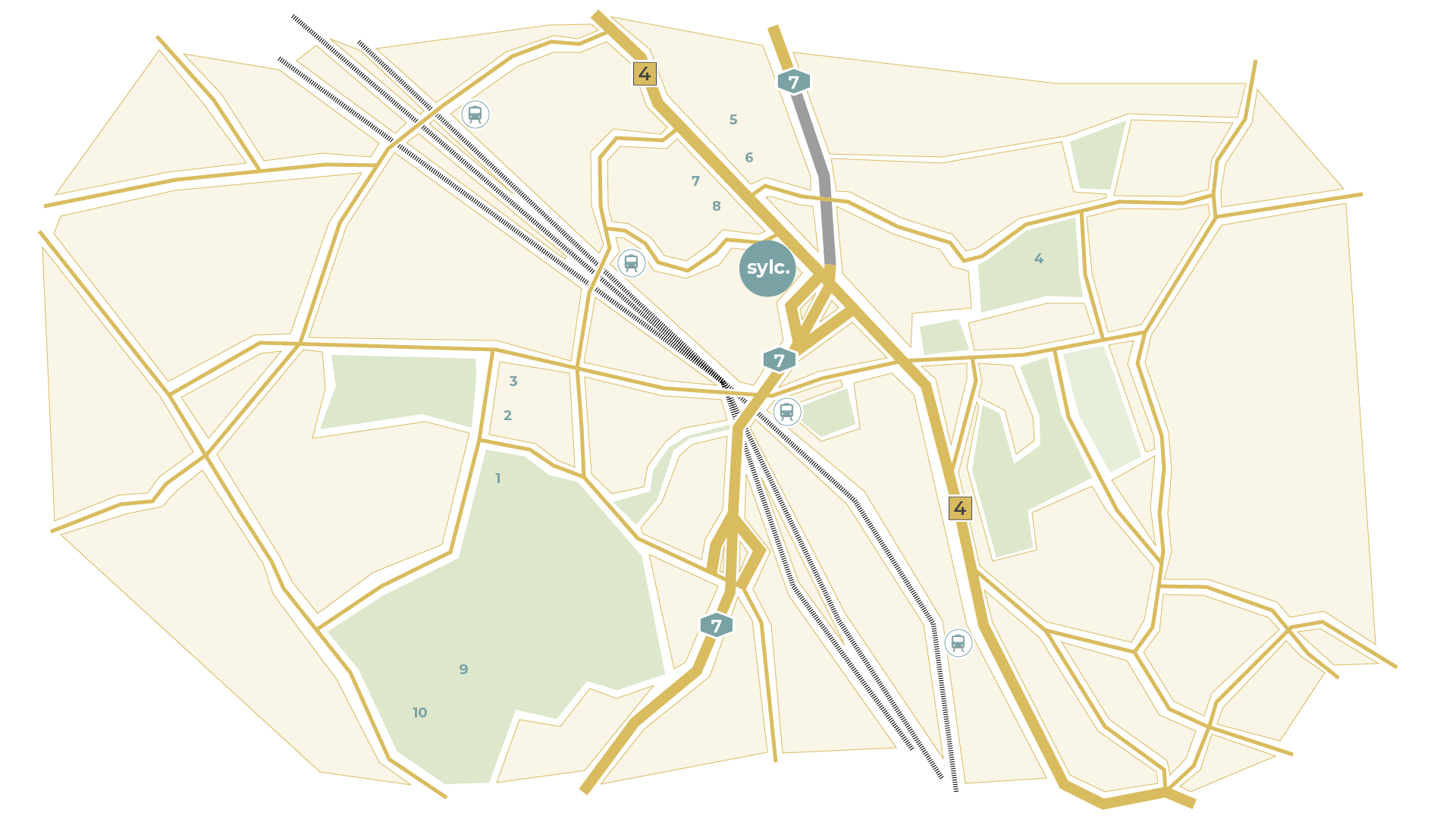 Map of a city with roads, railway lines, and green spaces. The central area has a prominent circle, likely representing a city center.