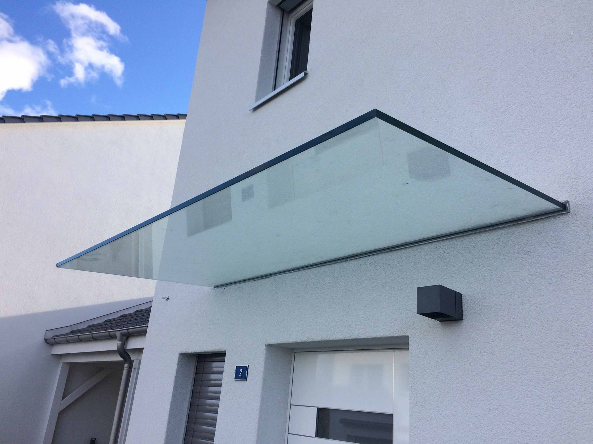 vordach glas - gebrüder meyer - zaunfabrik und schlosserei - münchenstein