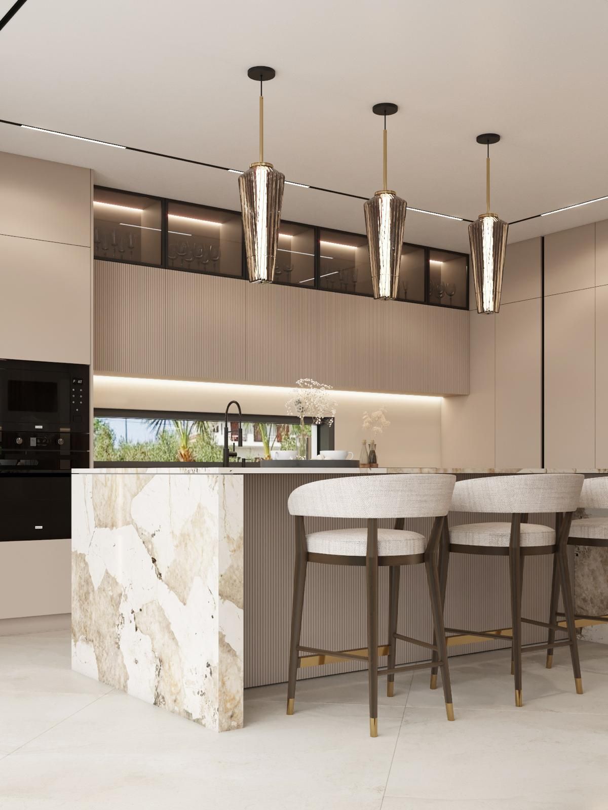 Una cocina con una gran isla y taburetes.