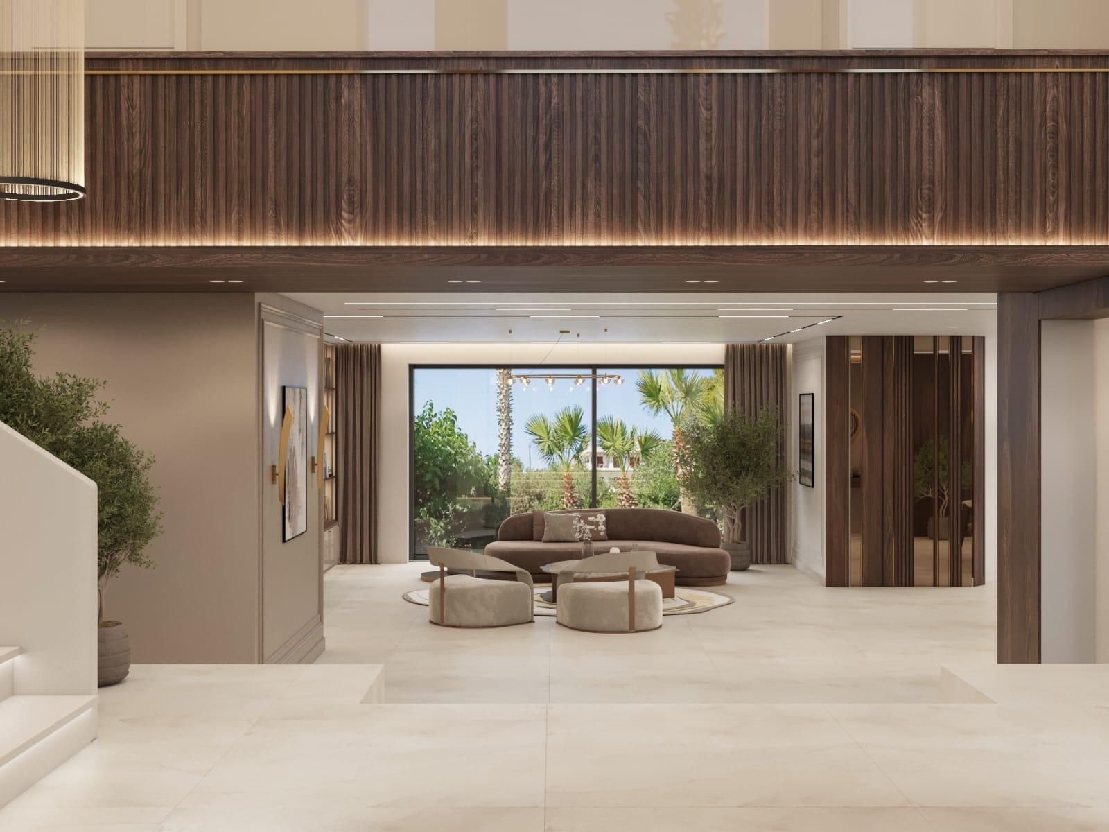 Una sala de estar con un sofá, otomanas y una ventana grande.