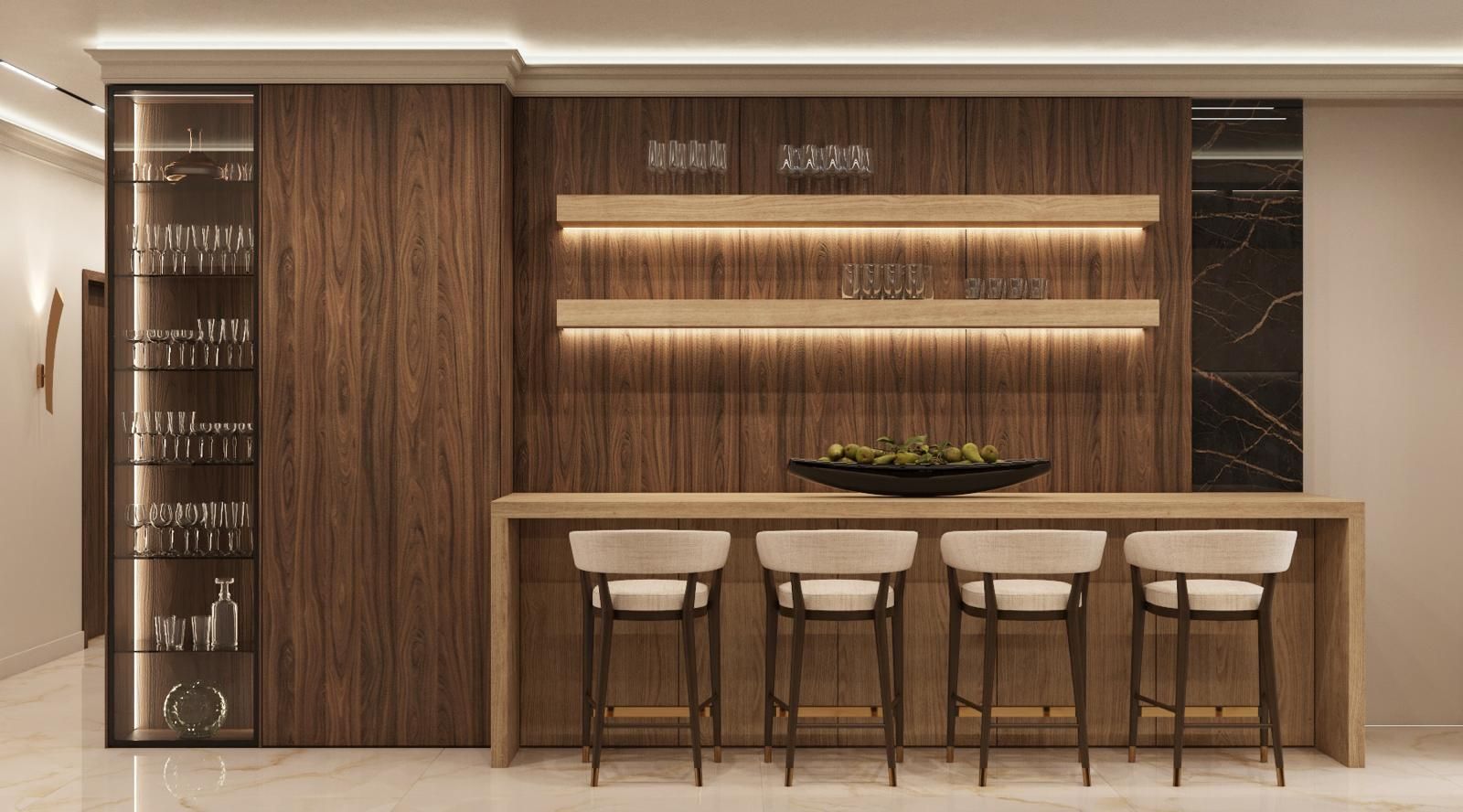 Una cocina con barra y taburetes y una pared de madera.