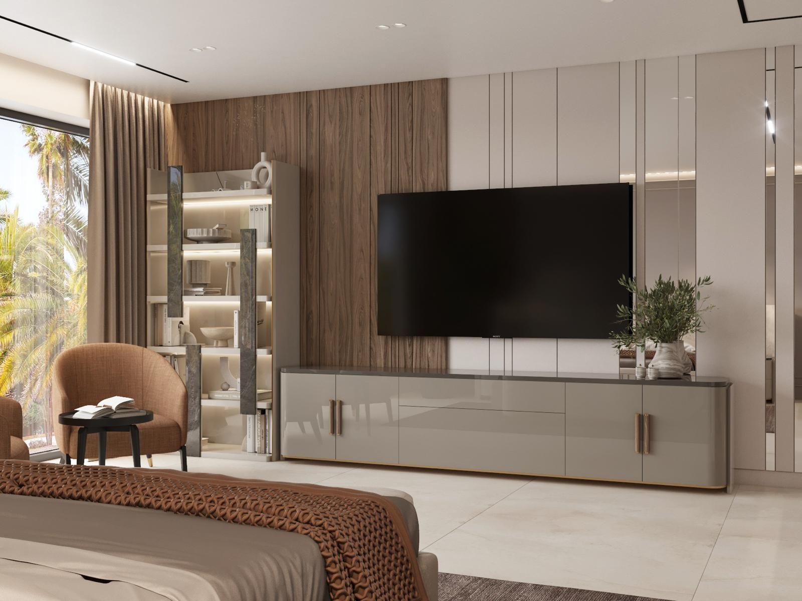 Un dormitorio con un televisor de pantalla plana grande en la pared.