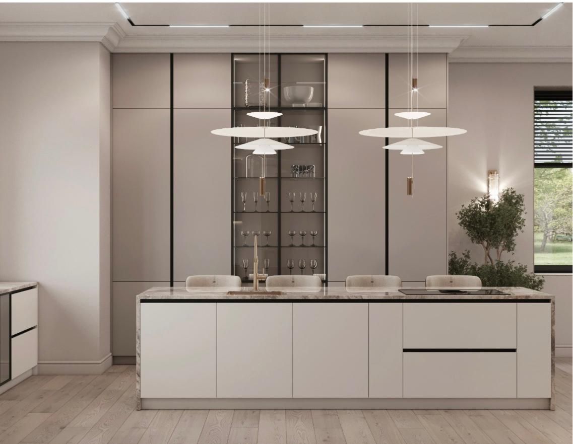 Una cocina con gabinetes blancos y una gran isla en el medio.