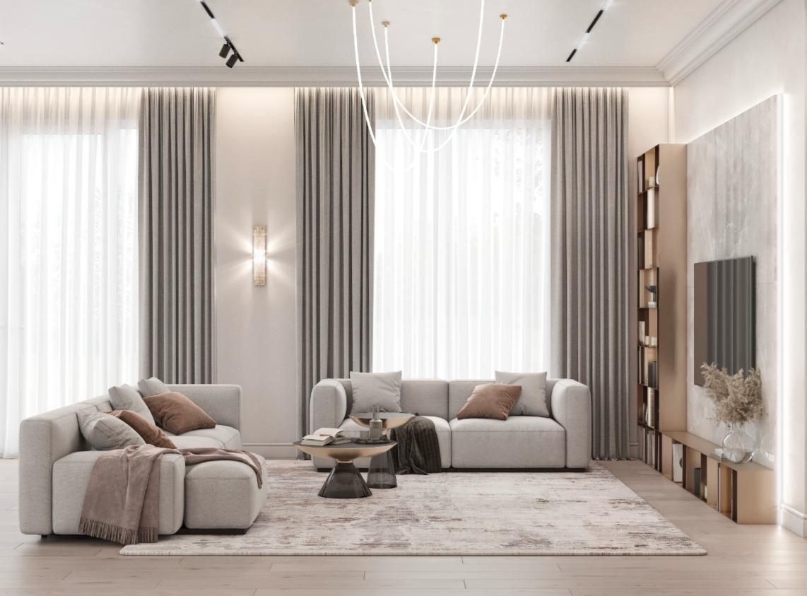 Una sala de estar con sofá, mesa de café y televisión.