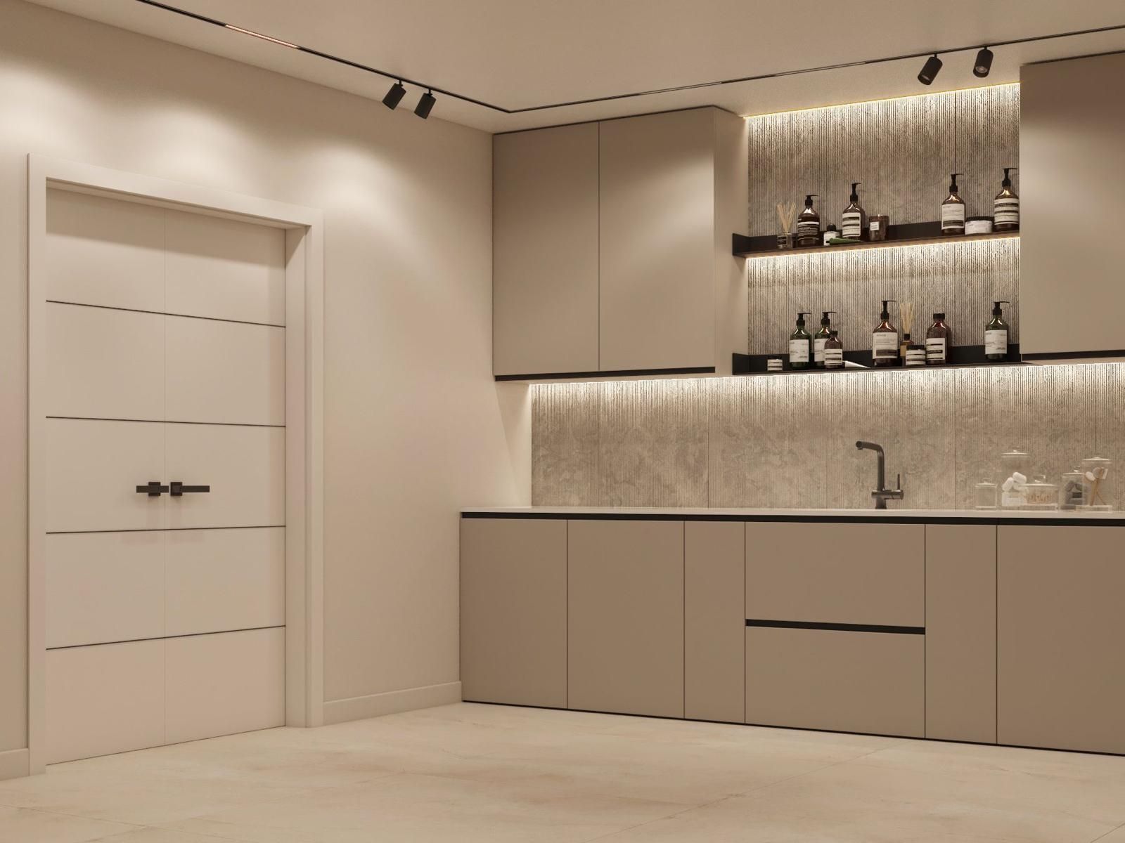 Una cocina con fregadero, armarios, estantes y botellas en la pared.