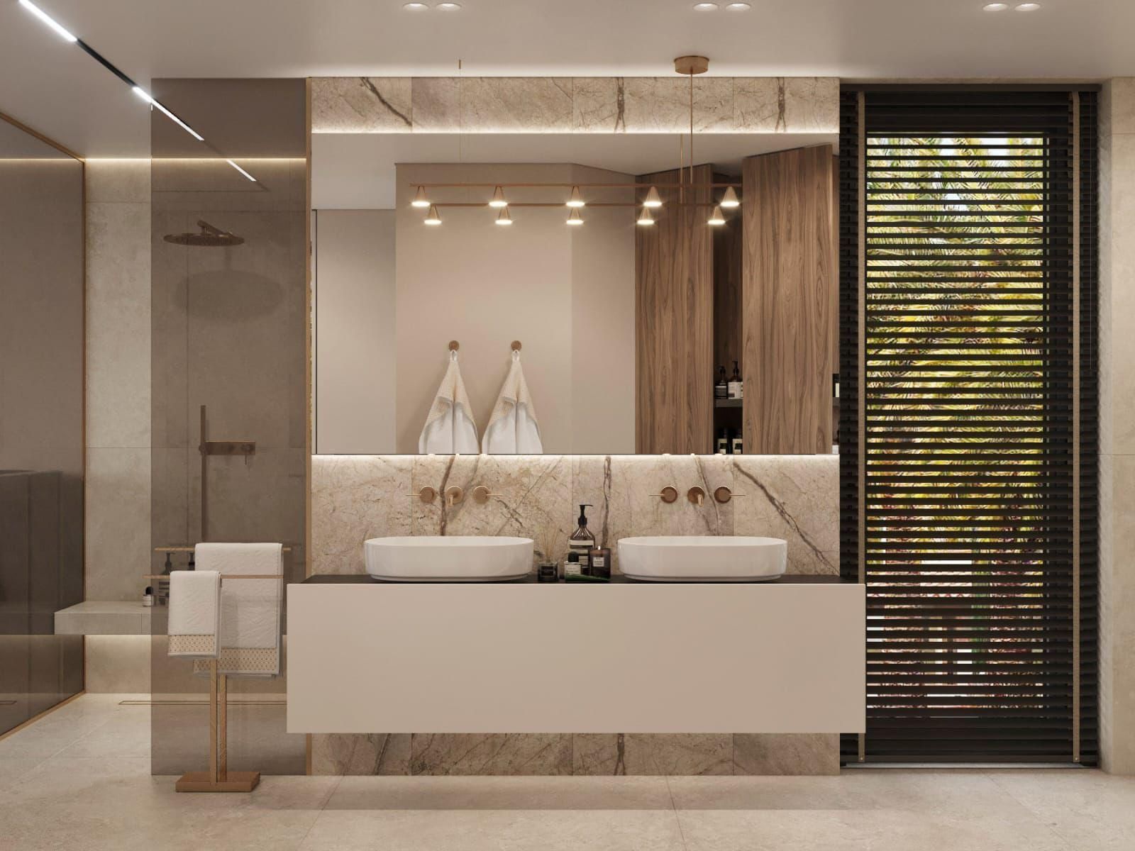 Un baño con dos lavabos y un espejo grande.