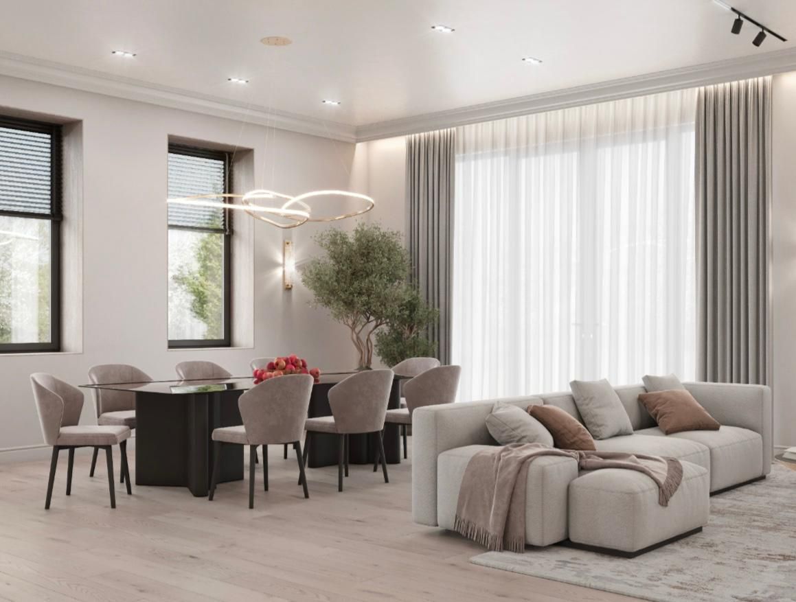 Una sala de estar con un sofá, sillas y una mesa.