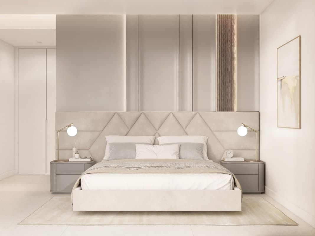 Un dormitorio con una cama, mesitas de noche y un espejo en la pared.