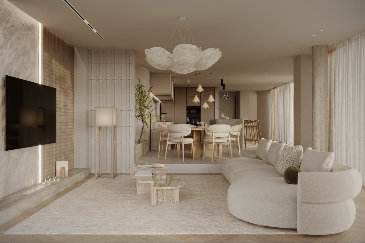 Una sala de estar con sofá, televisión, mesa y sillas.