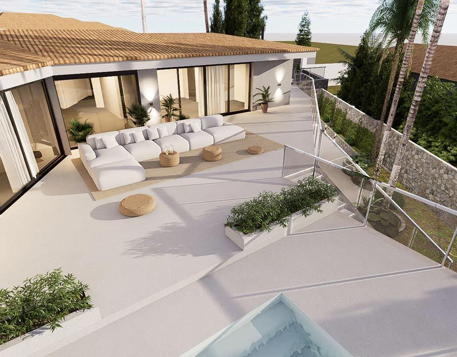 Una cocina con encimera de mármol y taburetes.