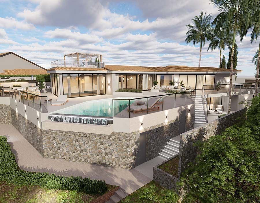 Una cocina con una gran isla, taburetes y un refrigerador.