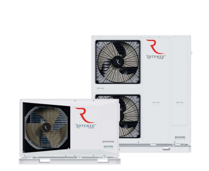 Un plombier raccorde des tuyaux à un chauffe-eau blanc, à l'intérieur.